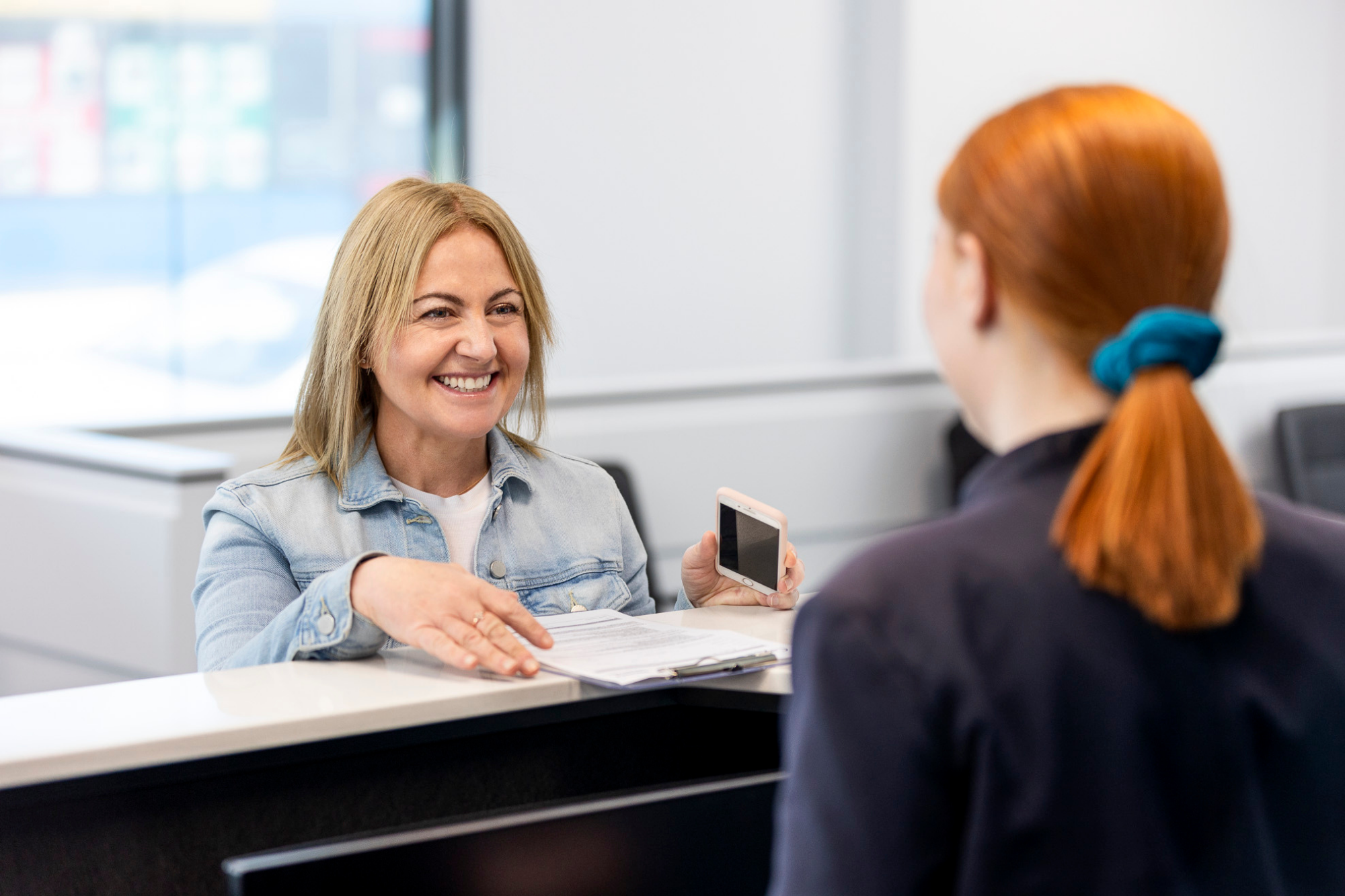 Female Paying Bills at a Payment Center | Ultrasound Clinic Centre | Capital Radiology