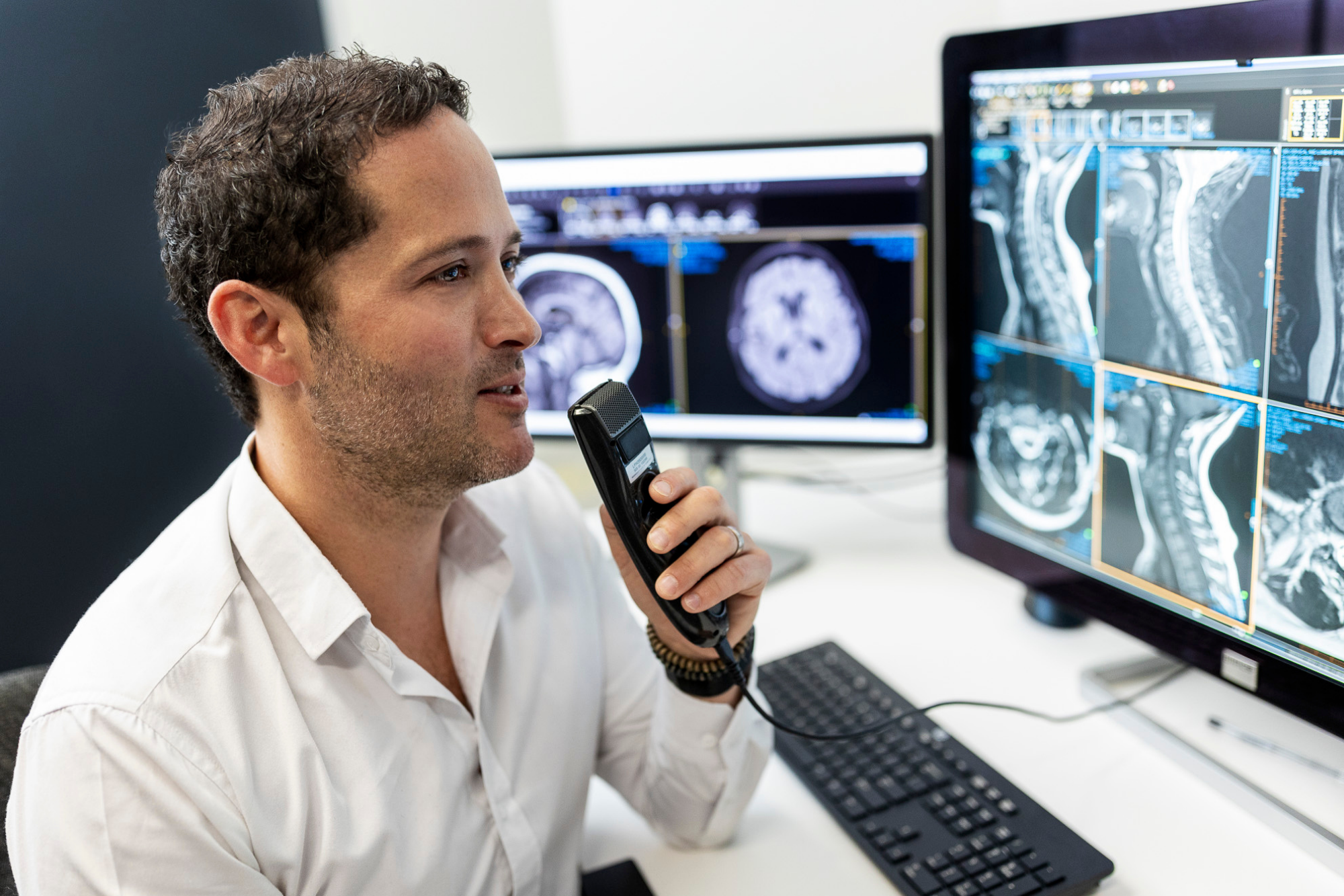 Man Announcing Something While Looking at X ray Screen | Medical Imaging Center | Capital Radiology