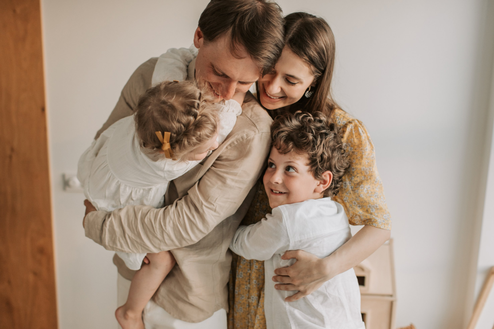 Family of Four Happily Hugging Each Other | Australia Radiology Clinic | Capital Radiology