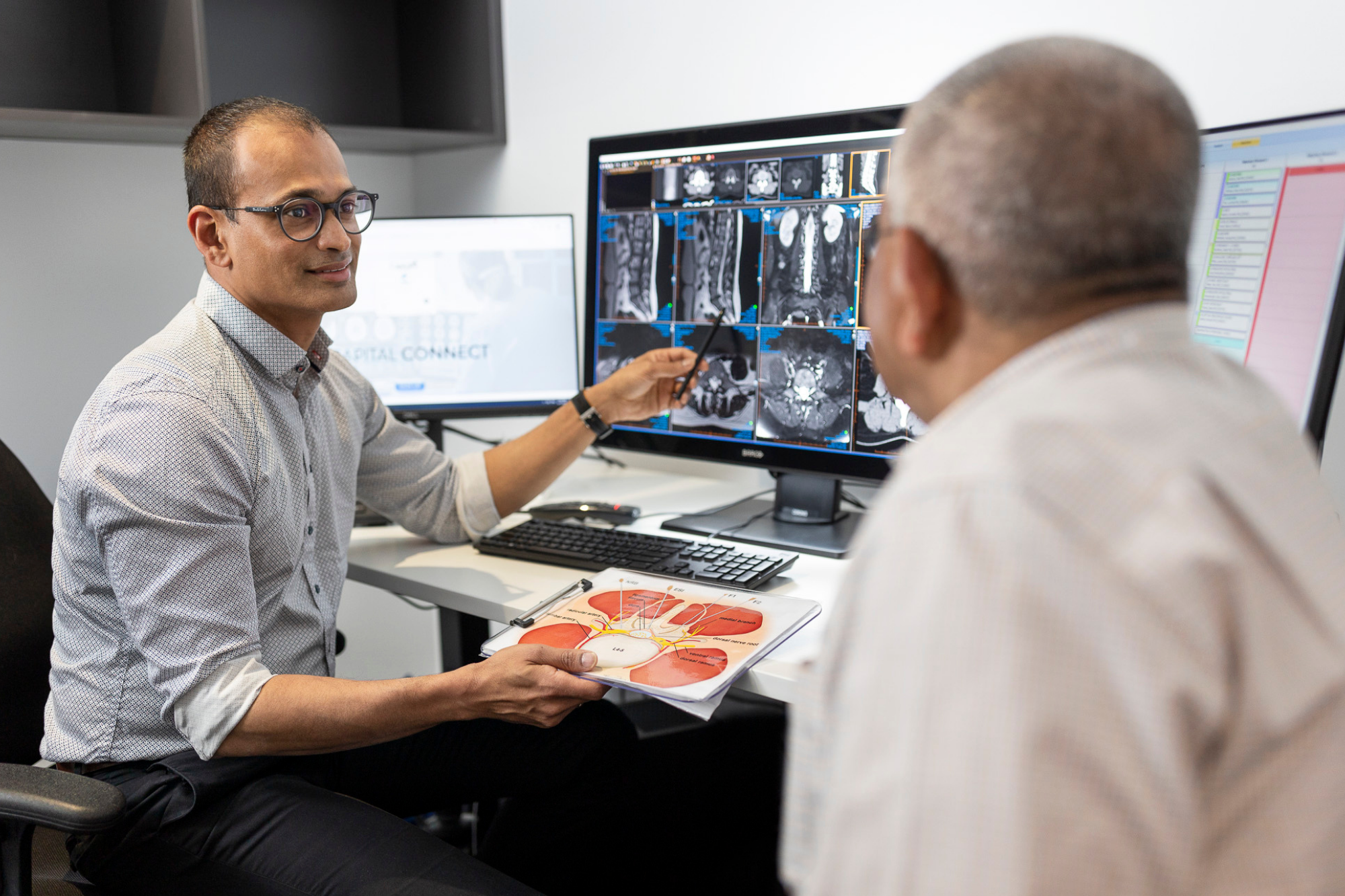 Male Doctor Explains Medical X ray Results to Patient | Interventional Procedure | Capital Radiology